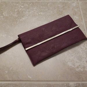 Purple wristlet with lace embossing